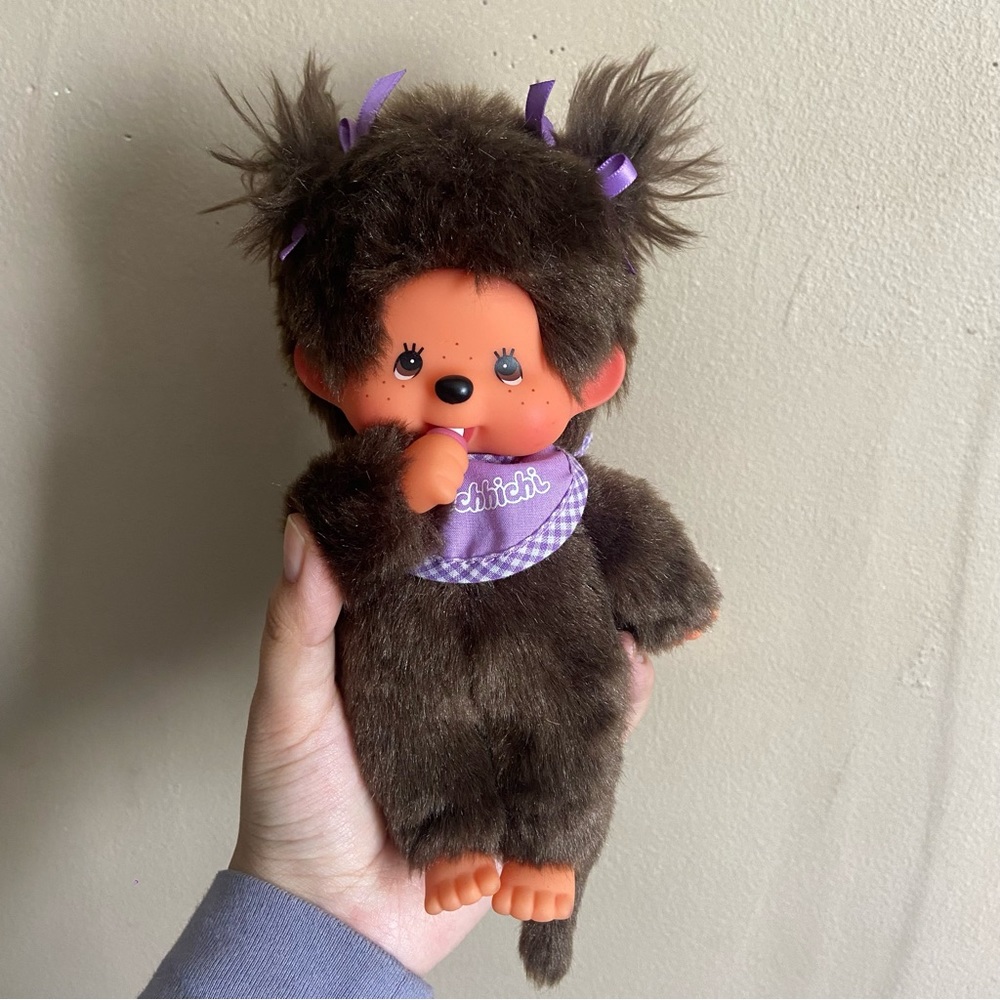 Fluffy MONCHHICHI toy doll purple bib and bow with pacifier